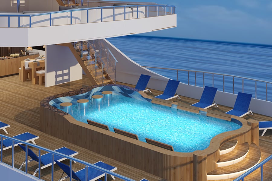 On one of the decks of the liveaboards has a pool with several seats around it. 